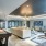 Resident clubhouse with games and seating inside Rivermark Northern Liberties Apartments